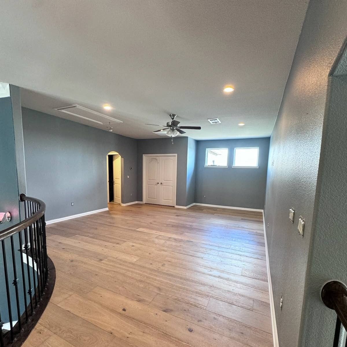 Upstairs living area with new hardwood floors and gray paint
